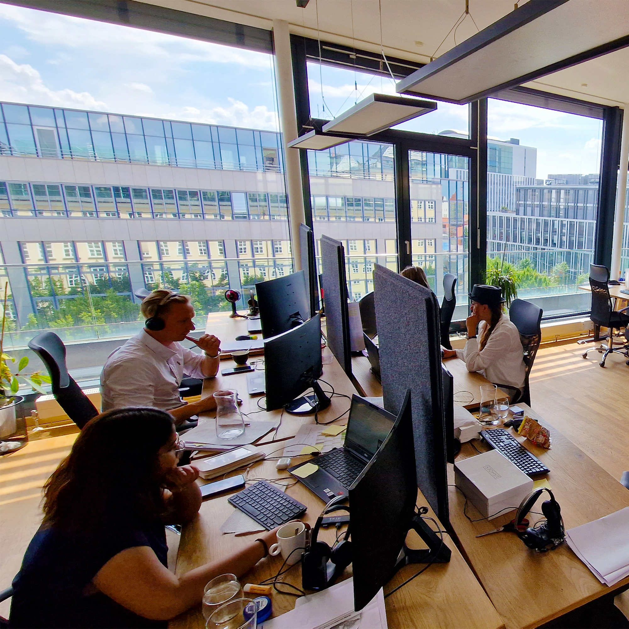 Some employees having a hybrid meeting